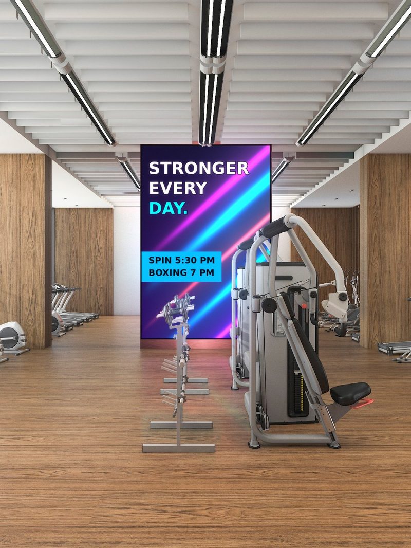 LED video wall showing the class schedule in a gym