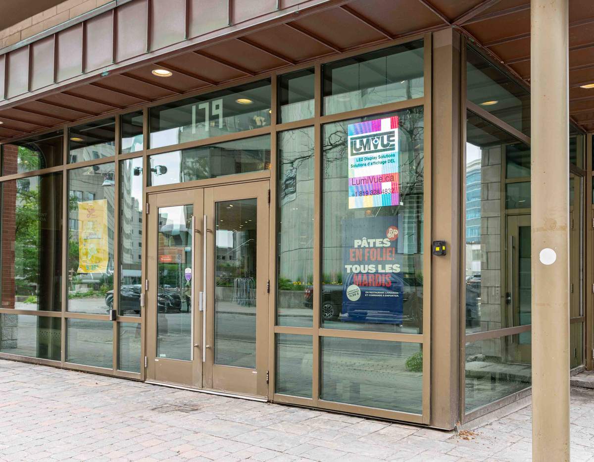 LumiVue LED display panel mounted at the LumiVue office storefront window, 179 Promenade du Portage, Gatineau